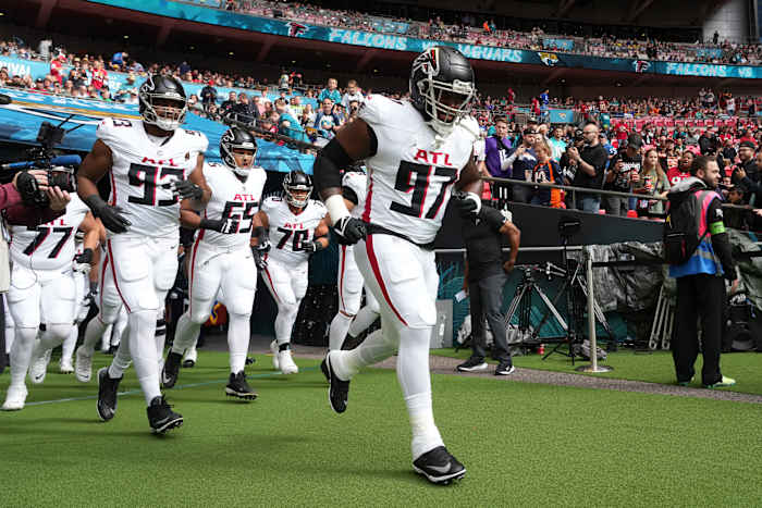 Oct 1, 2023; London, United Kingdom; Atlanta Falcons defensive end Grady Jarrett (97), defensive tackle Calais Campbell (93) and guard Matthew Bergeron (65) enter the field during an NFL International Series game against the Jacksonville Jaguars at Wembley Stadium. Mandatory Credit: Kirby Lee-USA TODAY Sports